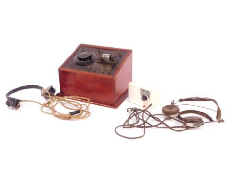 A vintage crystal radio set, with headphones, mahogany cased, together with an Ivalek Deluxe crystal set, boxed, and a furthe