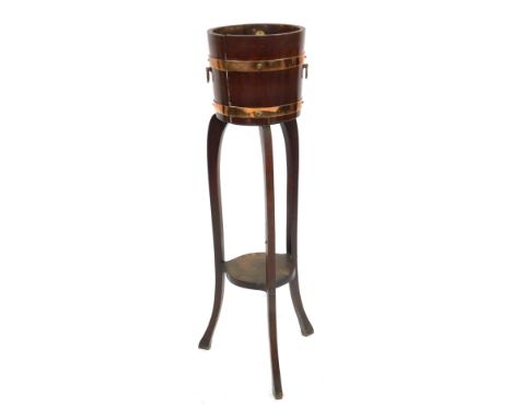 A George V oak palm tub, with copper banding and ring handles, on slender cabriole legs, bearing label for R A Lister &amp; C
