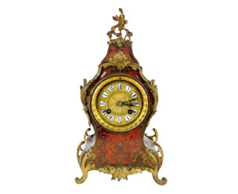A 19thC French Boulle work mantel clock, the circular embossed brass dial bearing raised porcelain Roman numerals, eight day,