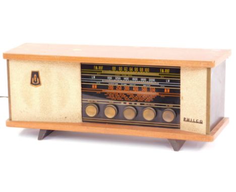 A Philco tabletop vintage radio, in teak case with glittered and panelled sides, 26cm high, 56cm wide, 19cm deep. 