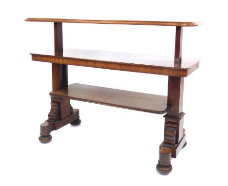 A Victorian mahogany metamorphic buffet, the top with a moulded edge raised on square end supports with scroll carving, on fo