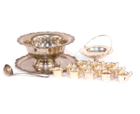 A silver plated punch bowl, together with twelve cups, ladle, a salver or stand, and a plated basket. 