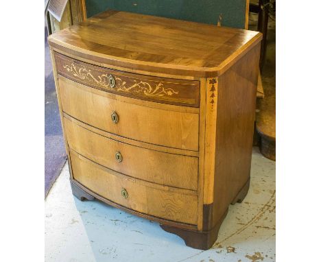 BOWFRONT COMMODE, early 19th century, Swedish elm, mahogany and marquetry, of four drawers, 77cm H x 74cm W x 47cm D.