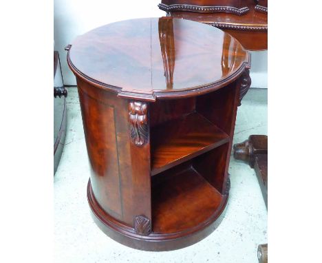 CYLINDER BOOKCASES, a pair, mahogany, each with carved detail, together with open shelf to front and back, on plinth bases, e