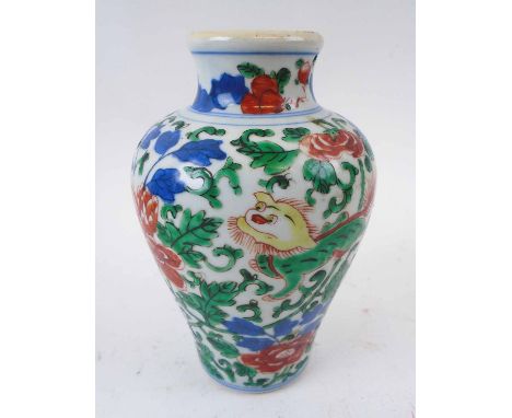 ORIENTAL CERAMIC VASE, with all over design of dragons amidst foliage, 19cm H. (small chip to rim)