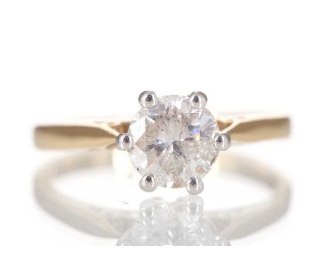 DIAMOND SOLITAIRE RING set with a round brilliant cut stone of approximately 1.00 carat, in eighteen carat gold, size L 1/23.