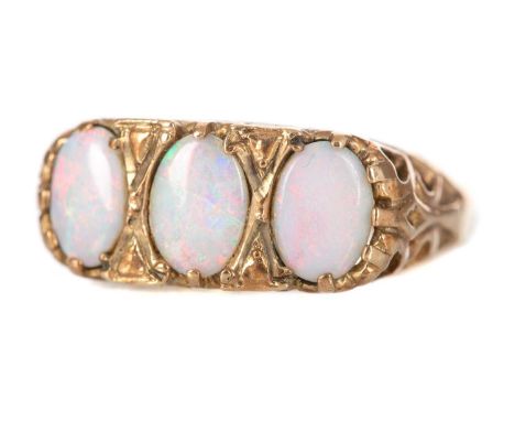 OPAL THREE STONE RING set with three oval stones,  in nine carat gold, size O3.3g