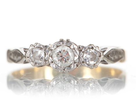 DIAMOND THREE STONE RING the illusion set diamonds totalling approximately 0.20 carats, marked 18CT &amp; PLAT, size K2g