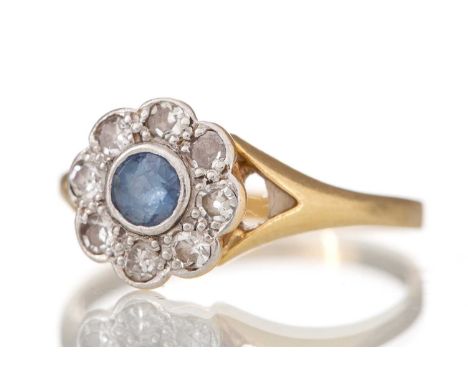 SAPPHIRE AND DIAMOND RING set with central sapphire within a halo of small diamonds, indistinctly marked, size L2.3gWorn cond