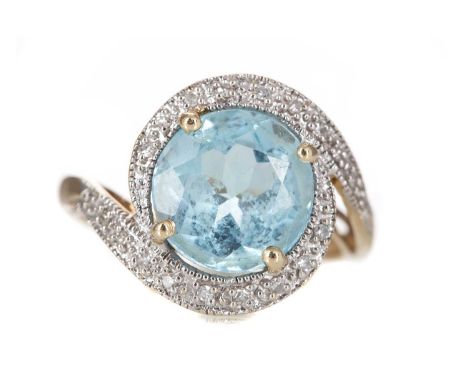 AQUAMARINE AND DIAMOND RING set with a round aquamarine within a swirling diamond halo, in nine carat gold, size M3.3g