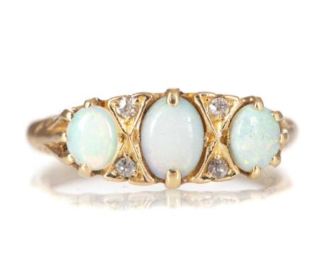 OPAL AND DIAMOND RING set with three oval opal interspaced by pairs of diamonds, in eighteen carat gold, size O4.2g