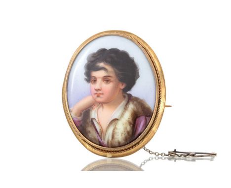 PORTRAIT MINIATURE BROOCH depicting an infant male in profile facing left44mm high