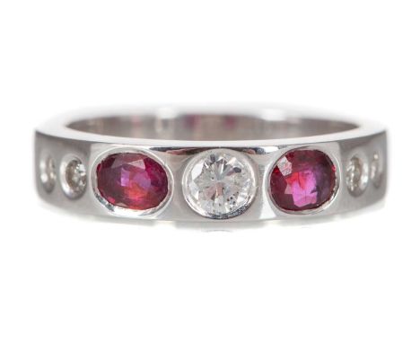 RUBY AND DIAMOND RING with countersunk rubies and diamonds, the diamonds totalling approximately 0.30 carats, unmarked, size 