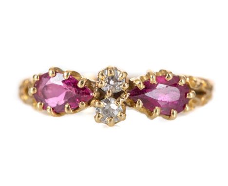 RUBY AND DIAMOND RING set with two pear shaped rubies flanking two old cut diamonds, in eighteen carat gold, size N3.3g