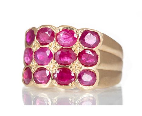 THREE ROW RUBY RING set with three rows of oval rubies, unmarked, size N5.7g