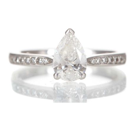 DIAMOND SOLITAIRE RING set with a pear shaped diamond of approximately 1.05 carats, on diamond shoulders totalling an additio