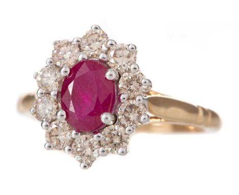 RUBY AND DIAMOND CLUSTER RING the oval ruby of approximately 0.80 carats, within a halo of round brilliant cut diamonds total