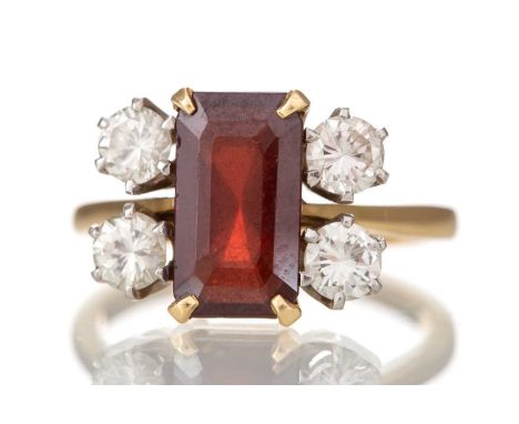 GARNET AND DIAMOND RING the step cut garnet flanked by round brilliant cut diamonds totalling approximately 1.00 carat, unmar