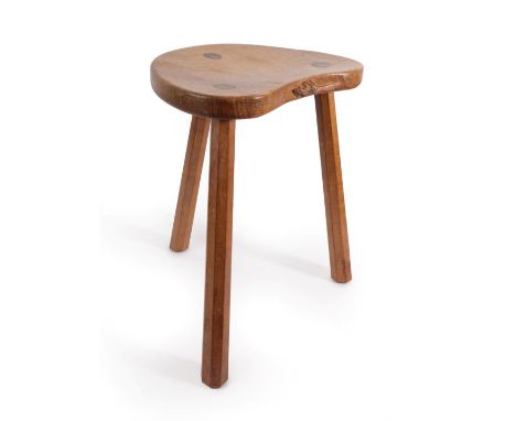 Workshop of Robert Mouseman Thompson (Kilburn): An English Oak Cow Stool, post 1970, the kidney shaped seat on three octagona