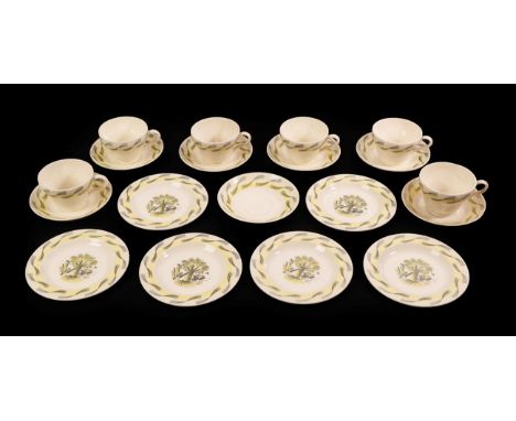 Eric Ravilious (1903-1942) for Wedgwood: A Garden Pattern Tea Service, printed sepia centre and border and enamelled yellow, 