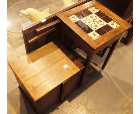 Oak two door cupboard and a tile top table