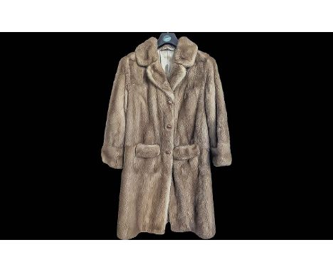 Ladies Quality Mink Coat, golden colour, collar and reveres, hook and eye fastening with button covers, two pockets, fully li