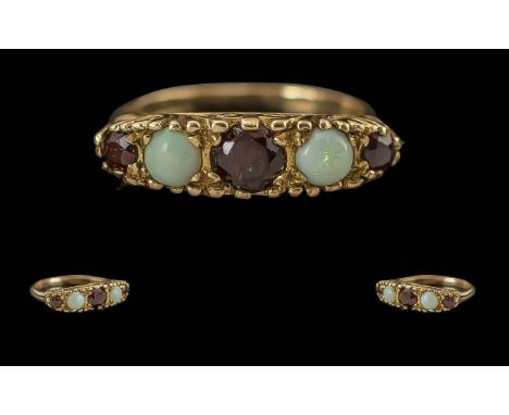 Ladies Attractive 9ct Gold Opal and Garnet Set Ring with ornate setting, full hallmark to interior of shank, opals and garnet