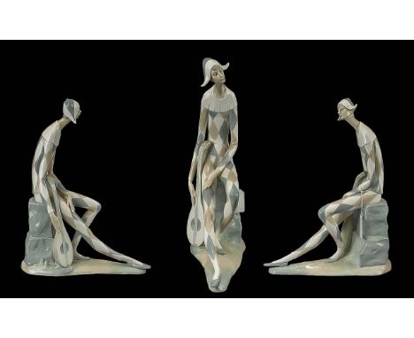Sad Harlequin Nao Lladro Figurine with Musical Instrument. This exquisite figurine captures the melancholic essence of a Sad 