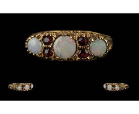 Ladies 9ct Gold Opal &amp; Garnet Set Ring, Fully Hallmarked for 9ct Gold. Approx Size R. Approx Weight 3.28 grams.