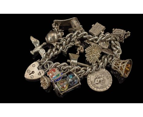 A Fine Vintage Sterling Silver Curb Bracelet Loaded with 14 Sterling Silver Charms of Various Subjects. All Marked for Sterli