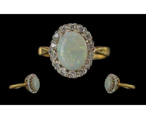 Ladies 18ct Gold Opal and Diamond Set Ring - Flower Head Setting, full hallmark to interior of shank, the oval shaped opal of