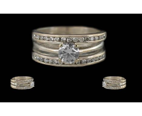 Ladies 18ct White Gold Diamond Set Contemporary Dress Ring, Marked 18ct to Interior of Shank. The Central Modern Brilliant Cu