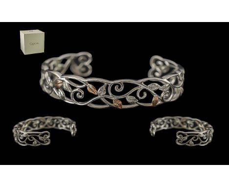 Clogau Silver Bangle, silver with central rose gold leaf design.  Comes in original box. Beautiful item.