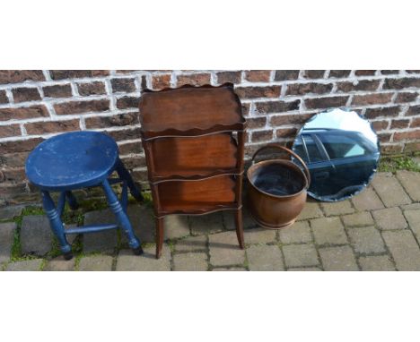 Stool, shelf unit, wall mirror and a copper bucket