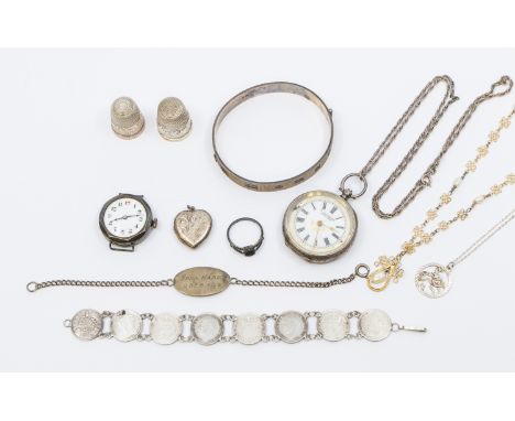 A collection of silver items to include a early 20th century watch face, (glass cracked case dented) a Swiss made key wind La