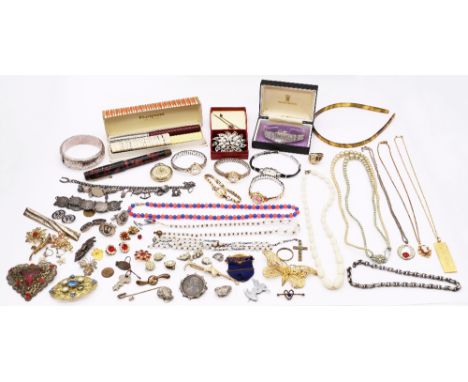 A collection of costume jewellery to include a silver charm bracelet, silver hinged bangle, silver mounted two shilling coin,