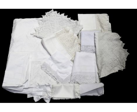 A collection of vintage white wear to include a 1930s nightdress case with slits for ribbon, embroidered centre, an Edwardian