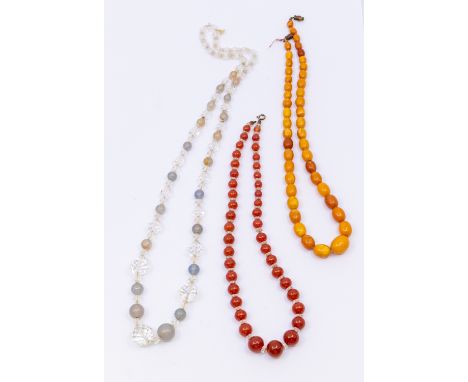 Three vintage necklaces including a graduated butterscotch amber bead necklace, the largest bead approx 15 x 12mm, smallest a