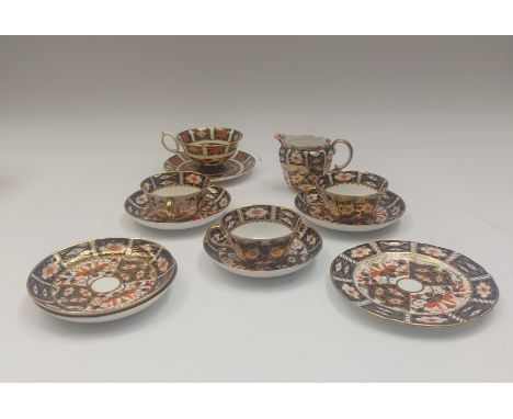 a small group of Royal Crown Derby items , to include 3 Imari cups &amp; saucers, 1 imari tea plate , Imari cream jug , 2 add