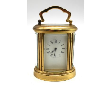 A miniature French brass 20th Century carriage clock.