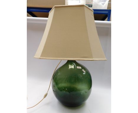 A 19th Century large green bottle converted to lamp with shade