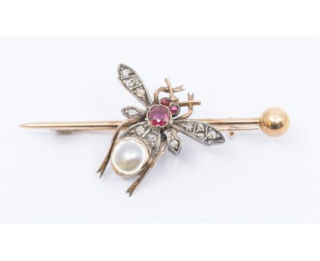 An early 20th century ruby and diamond gold set insect pin, the body and head set with rubies and mother of pearl the wings s