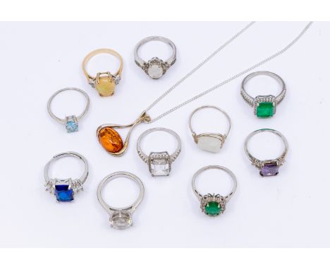 An opal and diamond 9ct gold dress ring, stamped 9ct, size P, total gross weight approx 3.3 grams with one silver pendant on 