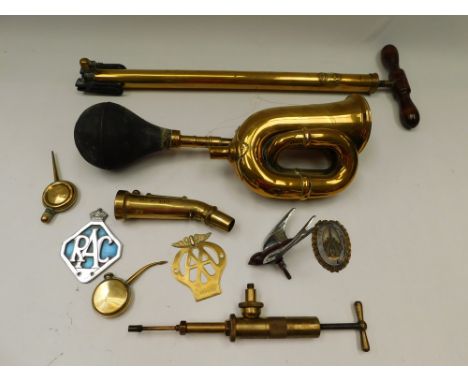 A collection of brass vintage car accessories to include horn of Lucas, Talbot pump, car mascot of a swift, AA/RAC badges, br