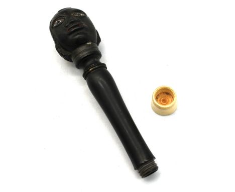 A scarce 18th century carved ebony pipe tamper, with turned bone screw off cap for housing a metal pipe cleaner (missing), ca