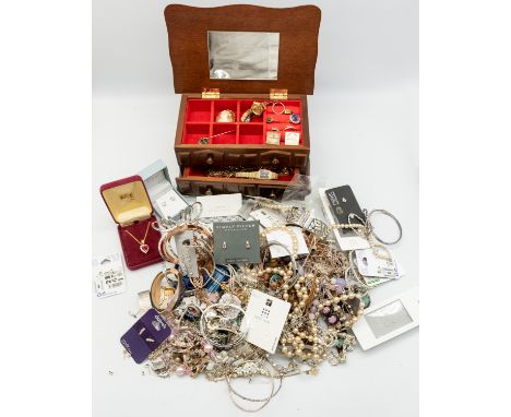 A large collection of costume jewellery to include various silver and white metal pendants and chains, collection of various 