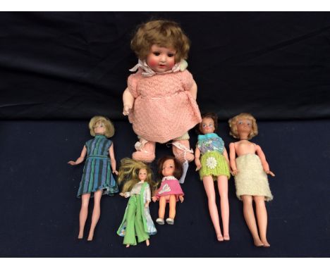 An Armand Marseille composition doll, marked to head, together with mixed Barbie-style dolls.