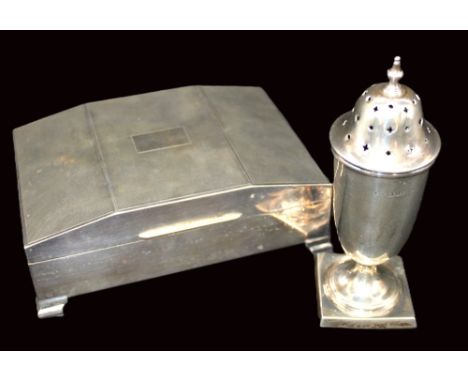 An Elizabeth II silver cigarette box, of angular shaped cover with engine turned decoration, on four stepped feet, with black