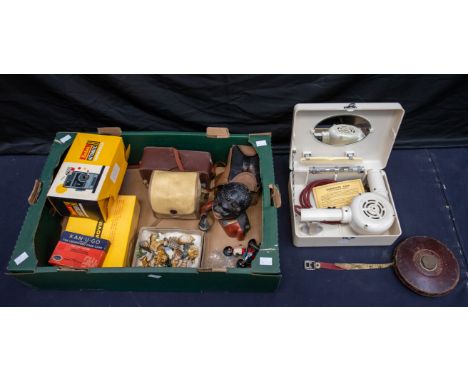 A collection of vintage cameras, Robinsons golly figures and badges, vintage hair dryer and golly money bank, early 20th Cent