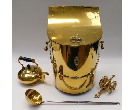A late 19th century large brass coal box with foliate banding and circular feet, with inner liner; an early 20th century bras